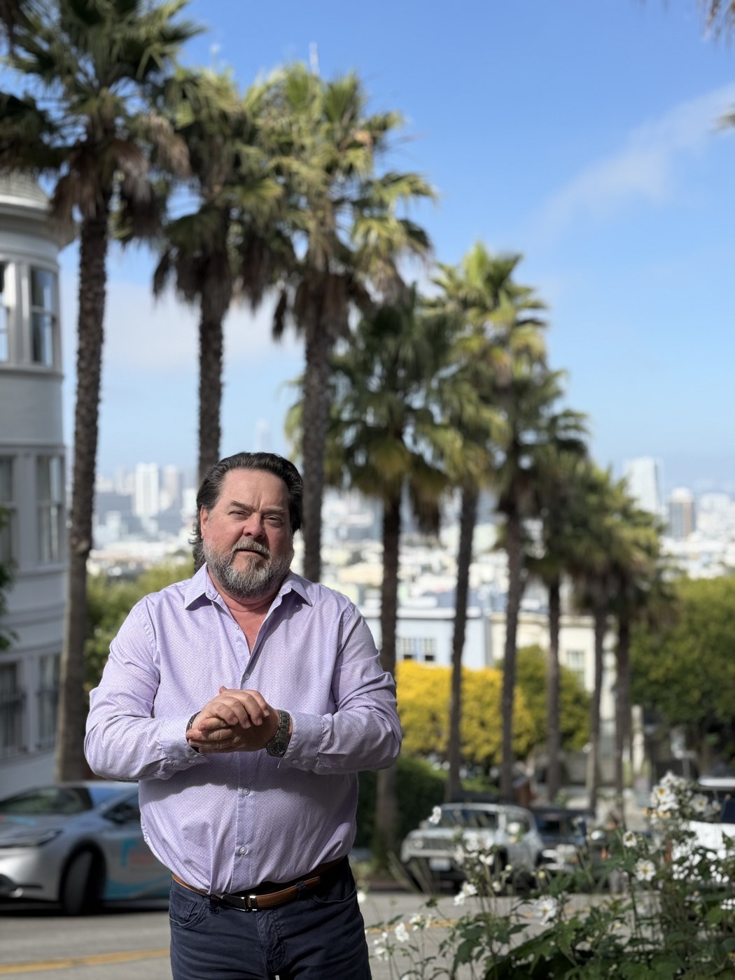 Eric Buckner on a palm-lined San Francisco street